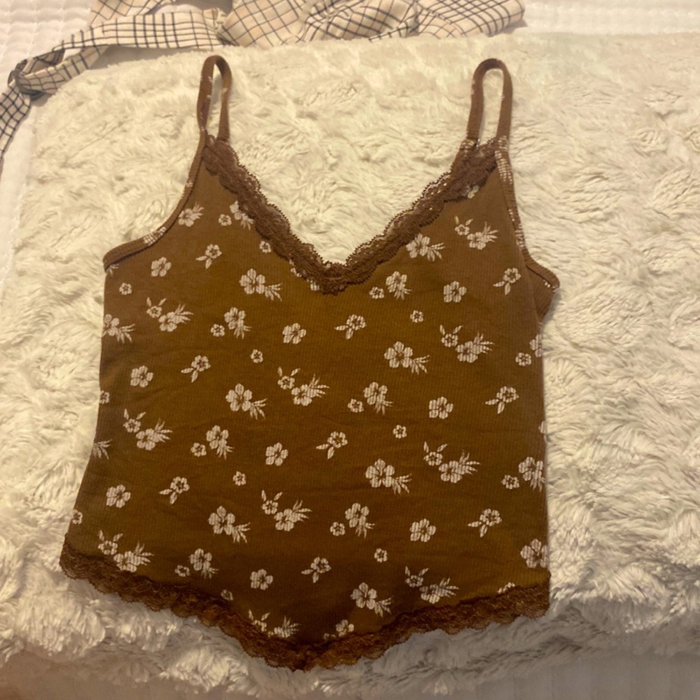cute small floral crop top with lace on the top and bottom.